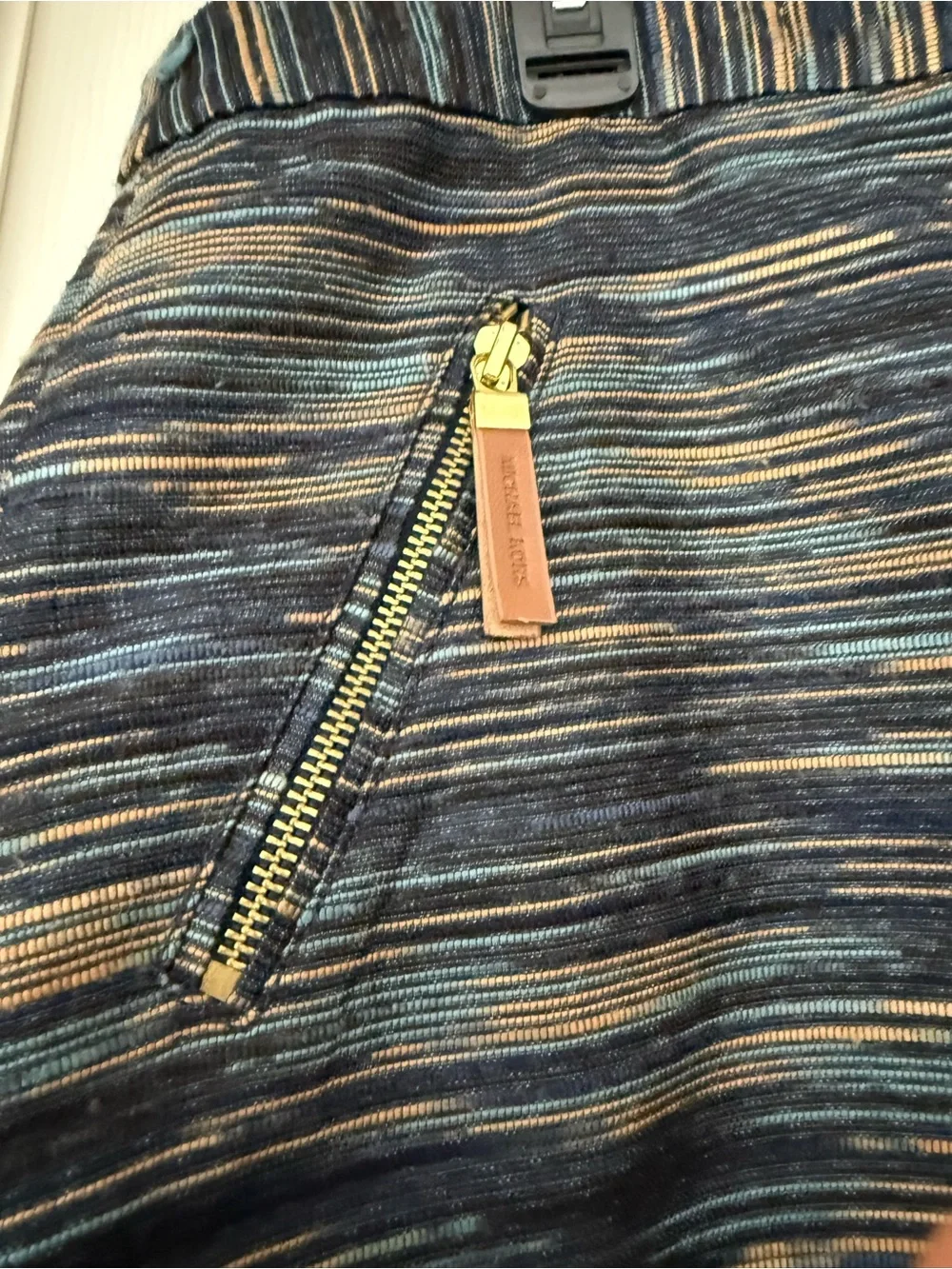 Michael Kors parentheses (white main label with silver lettering)